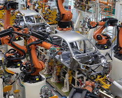 Robot arm assembling a car