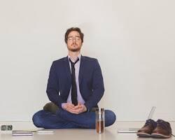 person meditating at work
