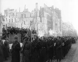 Polish soldiers fighting against German forces in the streets of Warsaw